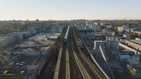 aerial view of a train in brooklyn. shot on an autumn morning in new york city.