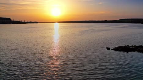 beautiful sunset is reflecting in the river. sunset lake landscape. colorful sky.