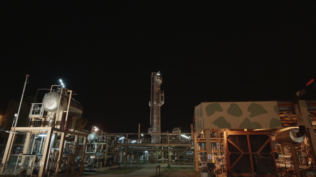 A static view big of an industry at night.