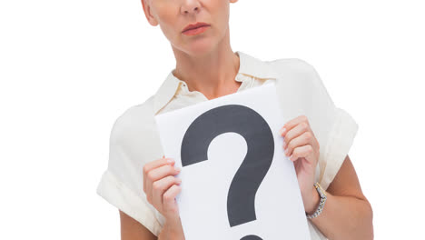 confused caucasian businesswoman holding question mark sign