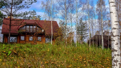 luxury wooden forest estate on sunny autumn day, time lapse