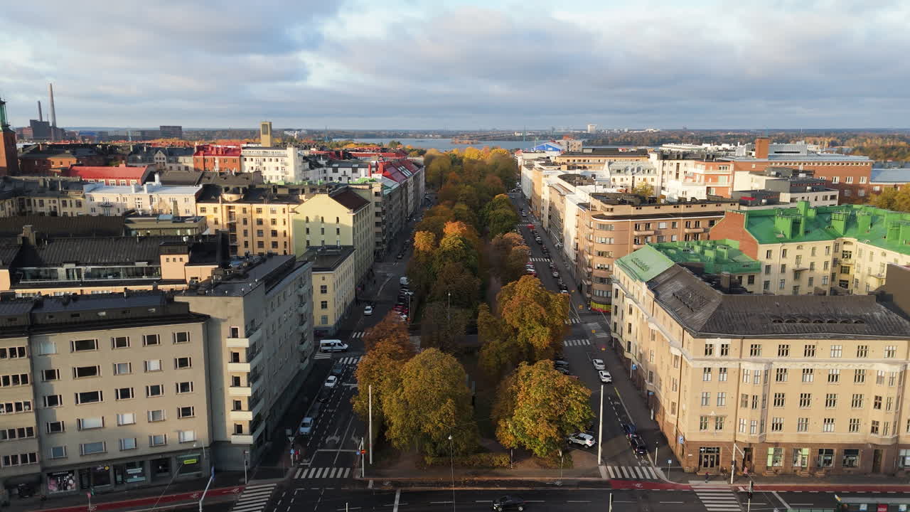 Aerial view of Helsinki city with classical buildings and boulevard with trees in autumn foliage colors
