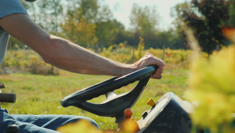 farmer driving small tractor