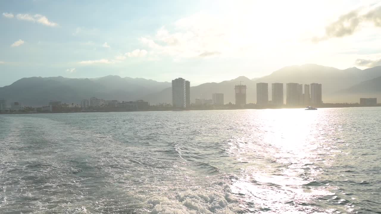 Sunrise over Puerto Vallarta Mexico viewed from a catamaran boat on the ocean