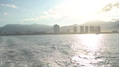 sunrise over puerto vallarta mexico viewed from a catamaran boat on the ocean