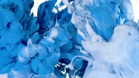 white and blue ink in water