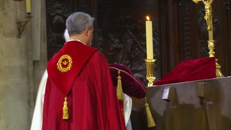 inside catholic notre dame cathedral in paris religious visitors kiss the holy relic 2