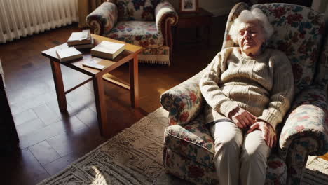 elderly woman relaxing in her living room