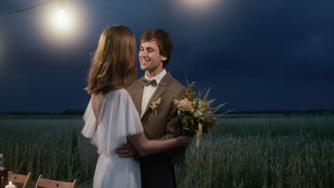 young couple in love in a fall field