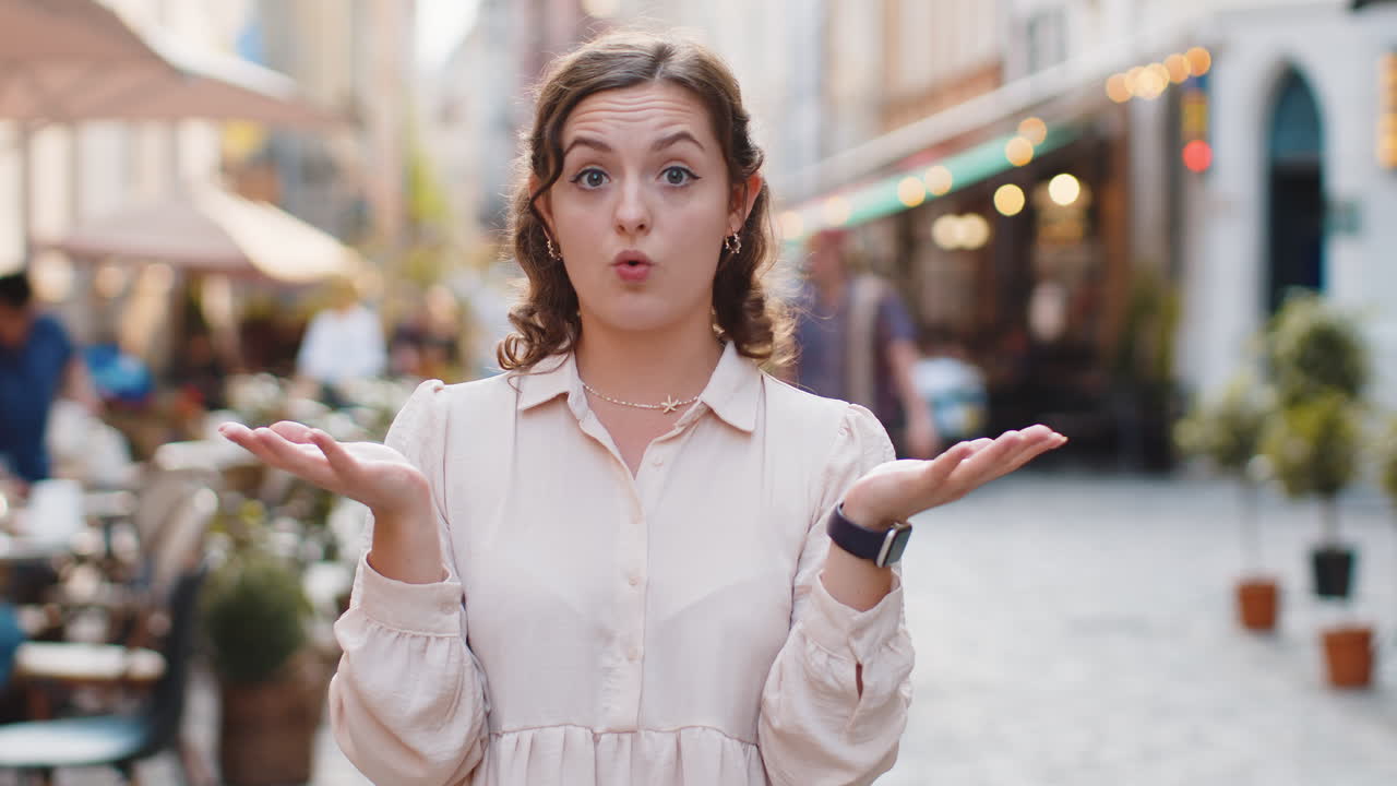 Confused woman feeling embarrassed about ambiguous question having doubts no idea in city street