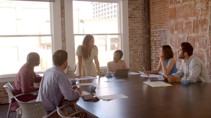 Businesswoman Standing To Address Boardroom Meeting