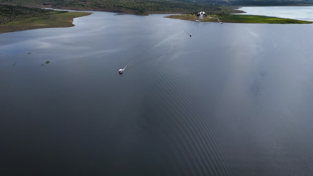 Midday drone panoramic and close-up of Cristo Roto island on Presa Calles, San José de Gracia, Aguascalientes, Mexico. Religious monument, Pueblo Mágico landmark, and cultural tourism site