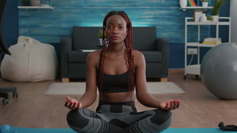 flexible flexible athlete woman relaxing in lotus position on floor