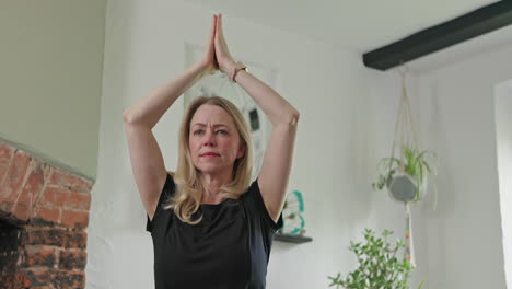 woman practicing yoga indoors