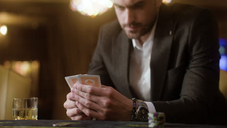 man playing poker in the casino.