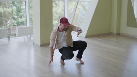 man breakdancing in modern studio