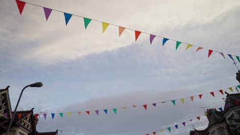 very-low angle shot of bunting from a street party as it blows in the wind