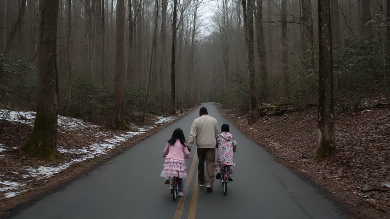 A Heartwarming Journey of Connection: A Family Riding Bicycles Down a Serene Forest Path Embracing Nature and Togetherness on a Misty Day