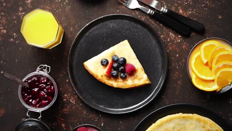 Tasety-homemade-pancake-on-black-ceramic-plate-