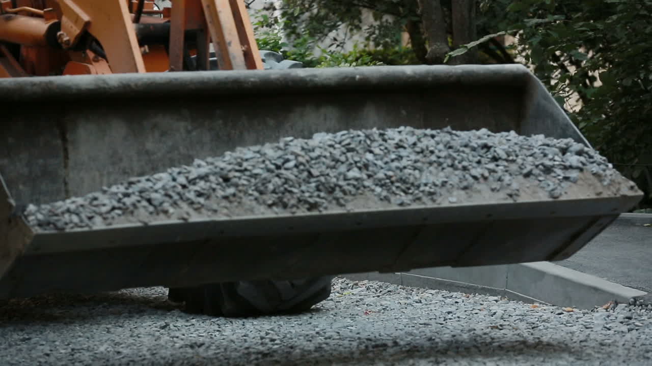 Workers During Work On Street. Road worker during asphalt pavement repair