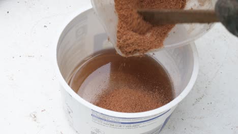 mixing sawdust with polyester resin glue