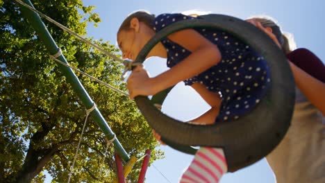 family playing in the playground 4k