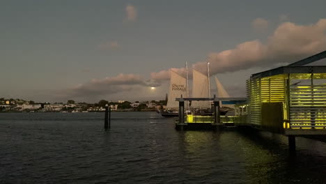 sailboat at dusk by the dock