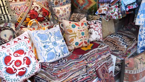 colorful cushions and rugs in a market