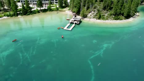 hotel lago di braies on shoreline of scenic pragser wildsee, aerial