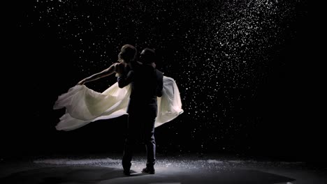 couple dancing in the snow