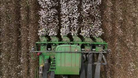 Cotton-picker-harvesting-a-field,-Top-down-aerial-view