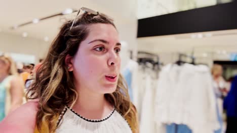 young woman shopping in modern clothing store