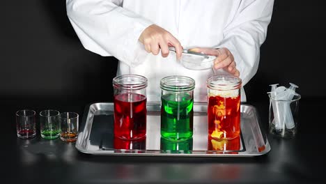 Colorful liquids react with dry ice and soap