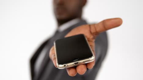 close-up of businessman hand showing mobile phone
