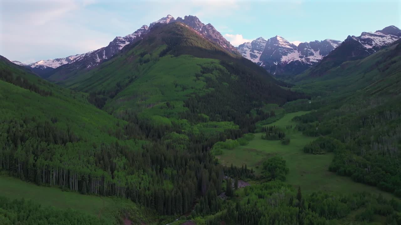 Aspen Snowmass valley Elk Range Rocky Mountains Colorado aerial drone Maroon Creek Pyramid Peak 14er Maroon Bells Wilderness sunset spring summer blue sky clouds Aspen Snowmass White River forward up