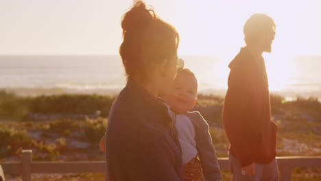 family walking in the beach 4k