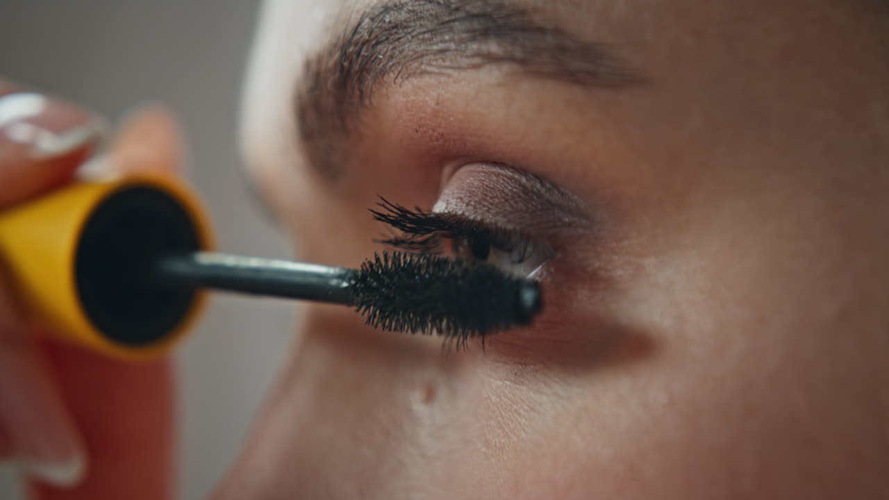 Applying mascara to eyelashes
