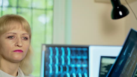 Doctor examining radiography. Close up of female doctor holding x-ray