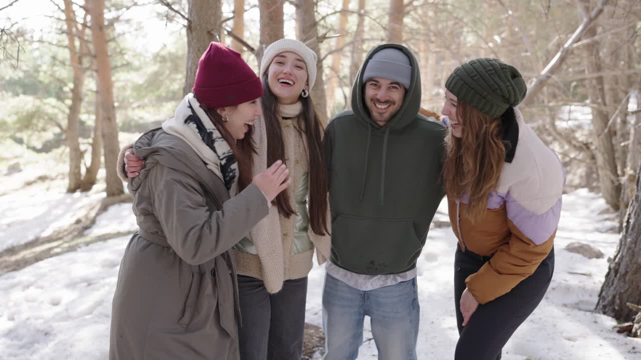 Friends enjoying a winter day in the forest