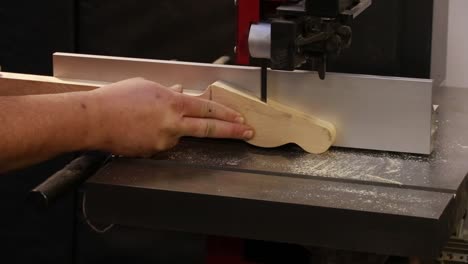 luthier working on guitar neck