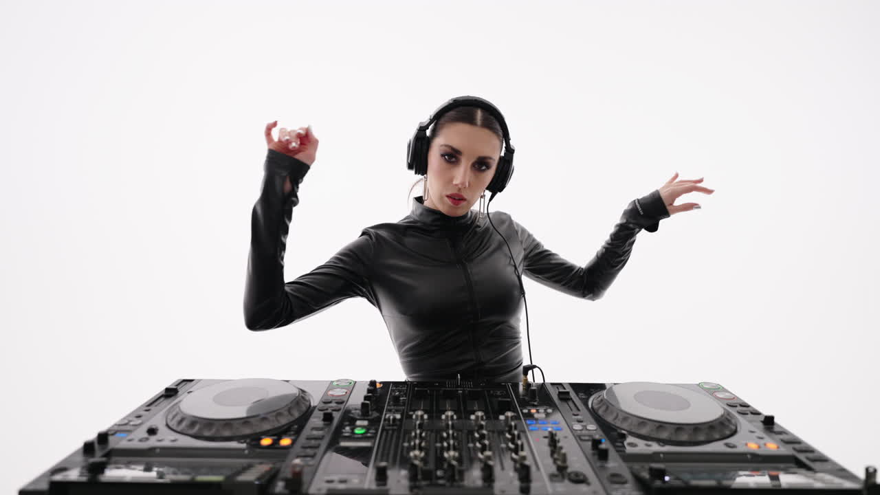 Female DJ mixing music on a turntable