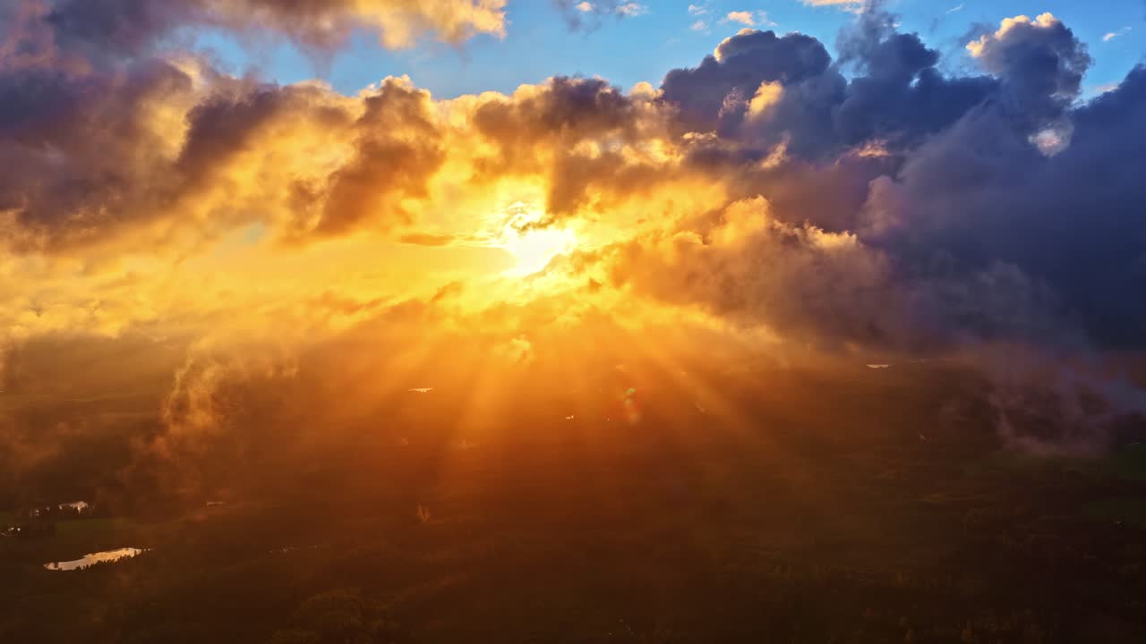 Golden Hour Light Rays Illuminate Valley Below Dramatic Cloud Formation