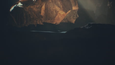 a head of the giant ancient deity statue hidden in a cave