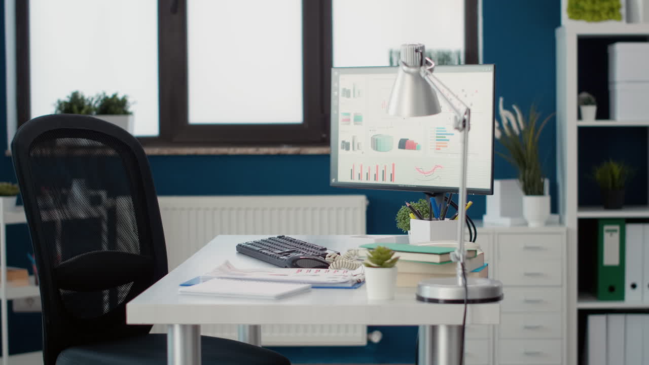 No people in empty business office with sales charts on computer