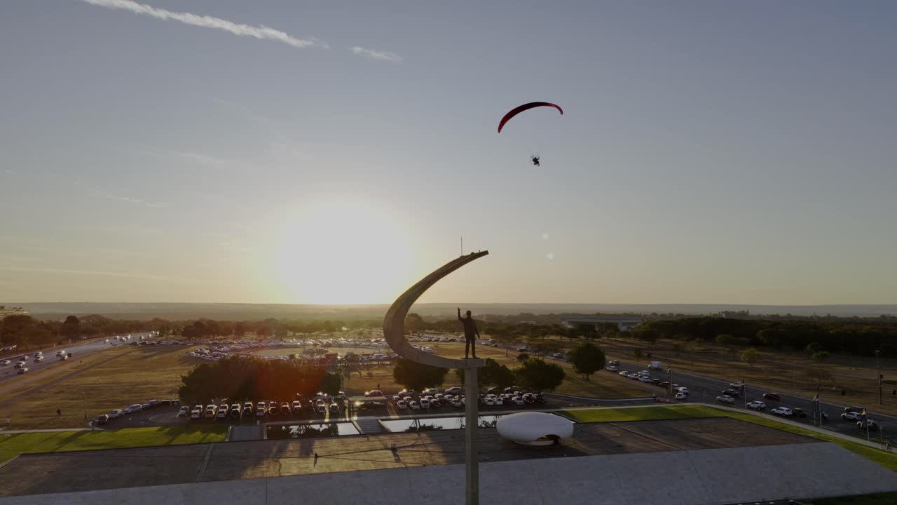 aerial view of the JK memorial with paragliding in the background - Brasilia