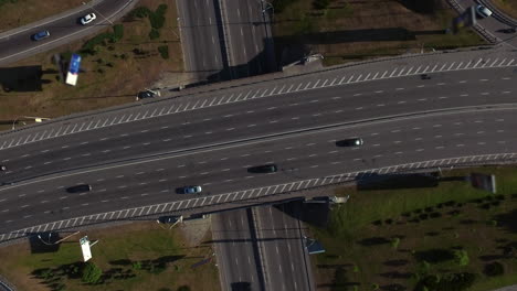 Cars-moving-on-freeway-top-view.-Aerial-view-car-traffic-on-highway-junction