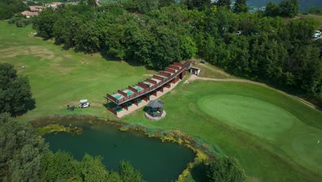 aerial view driving ranges at ca' degli ulivi' golf club beside lake