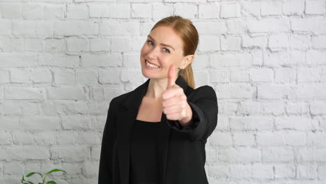 a businesswoman giving a thumbs up hand gesture, the girl raises her thumb and smiles