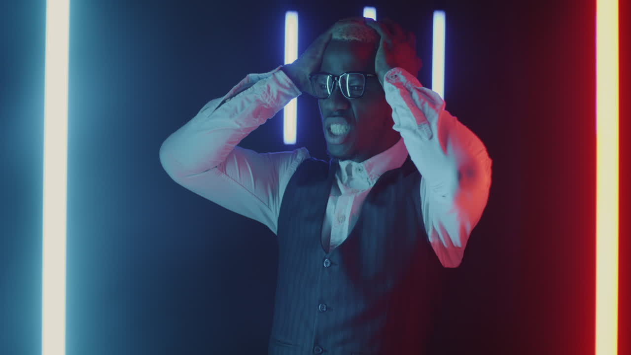 Man with changing emotions in neon light