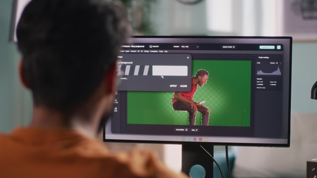 Person editing photos and videos on a computer